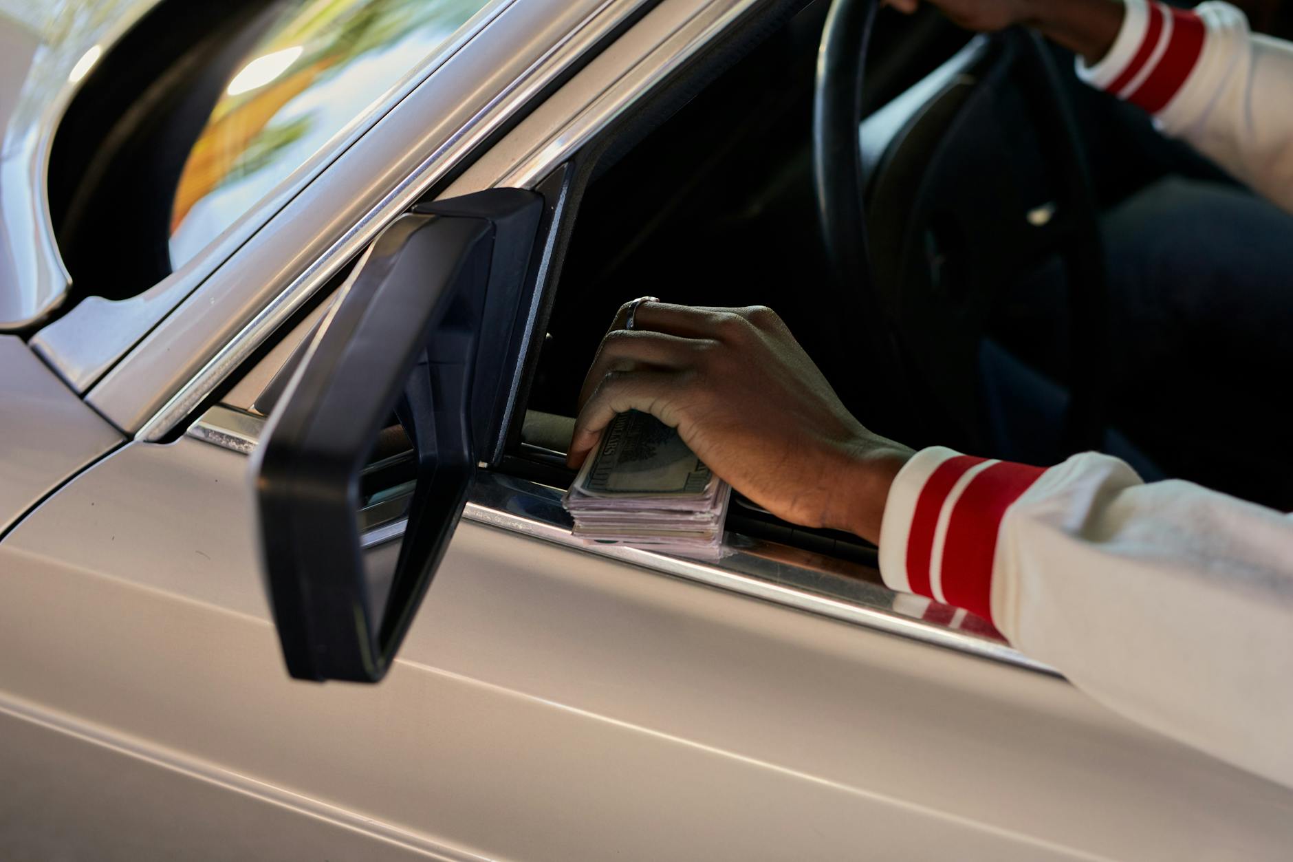 Car insurance documents and keys representing common car ownership mistakes