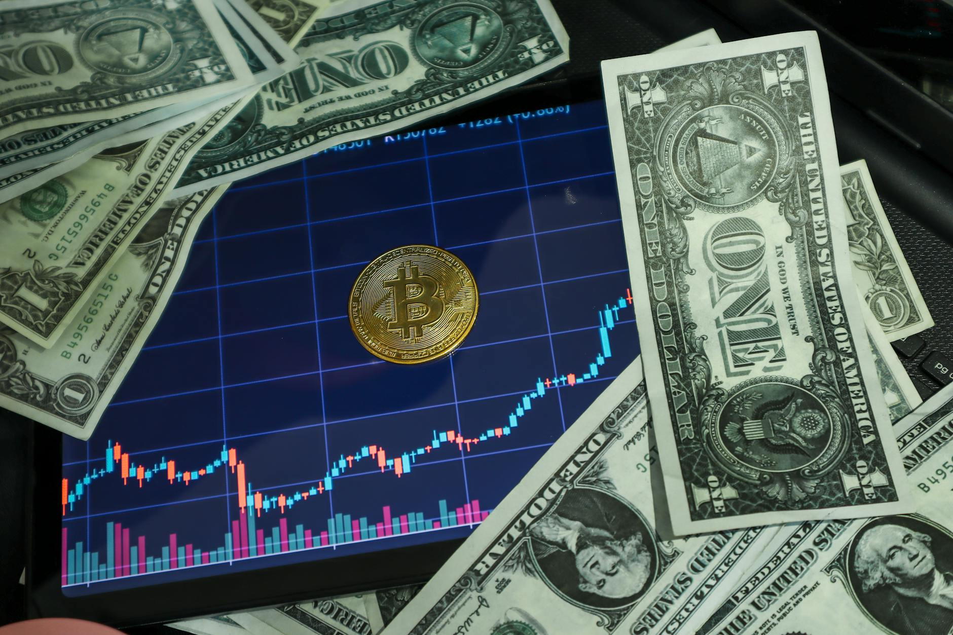 Person trading cryptocurrency on a screen showing digital currency charts