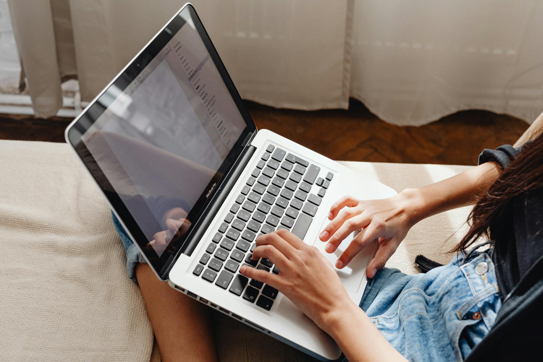 Person researching product niche on laptop