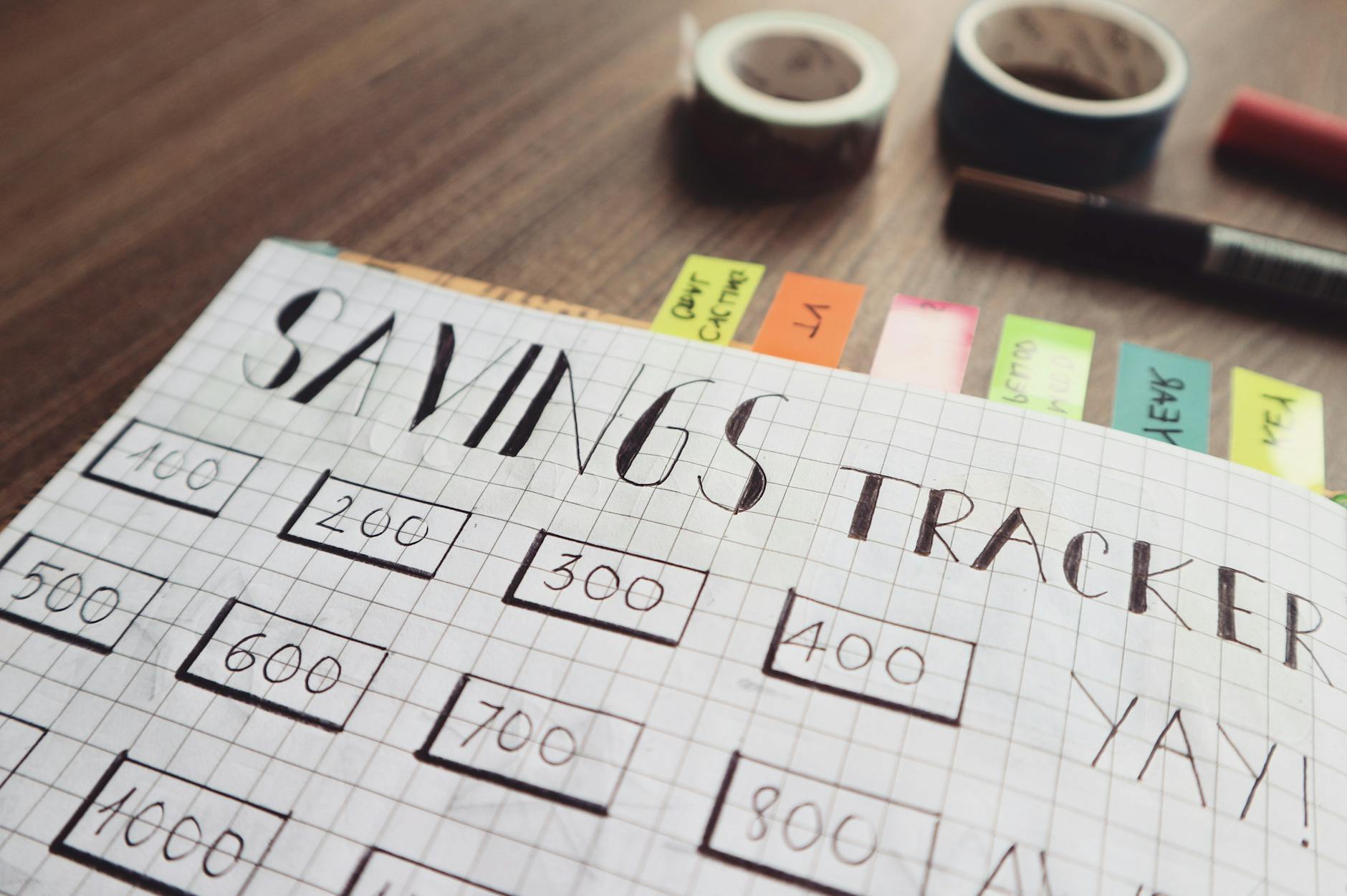 Person reviewing financial documents and tracking progress