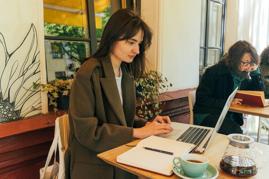 Person working on laptop as a freelance writer from home
