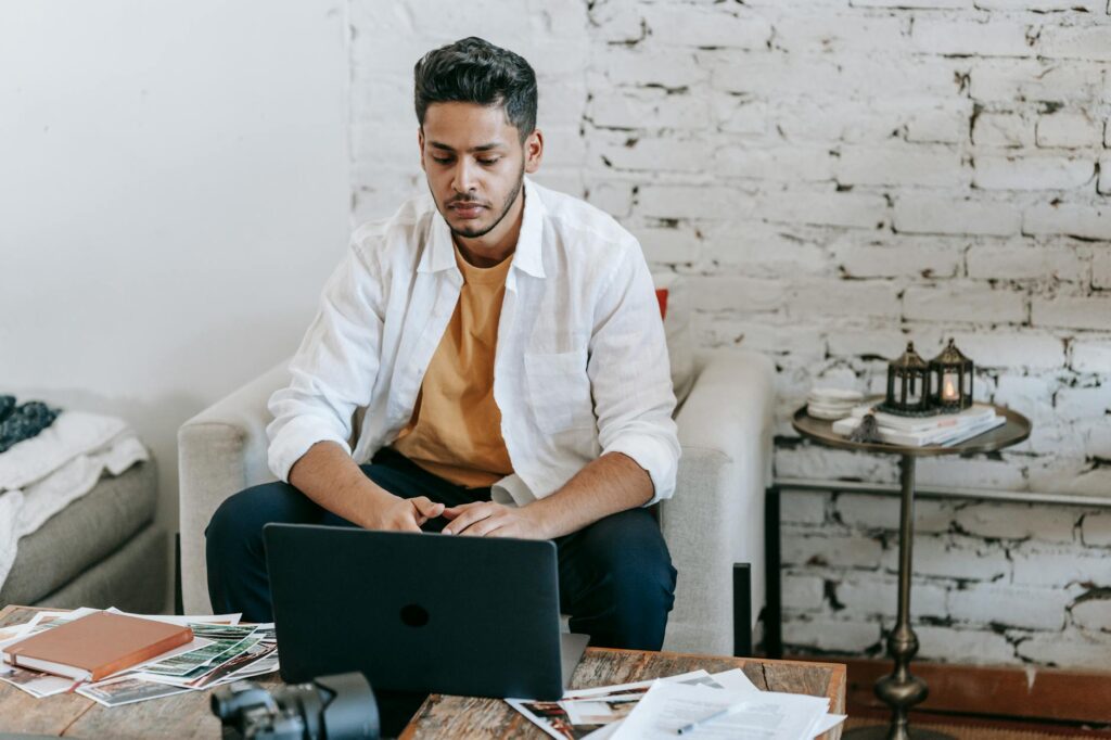 Freelancer working on laptop selling skills online