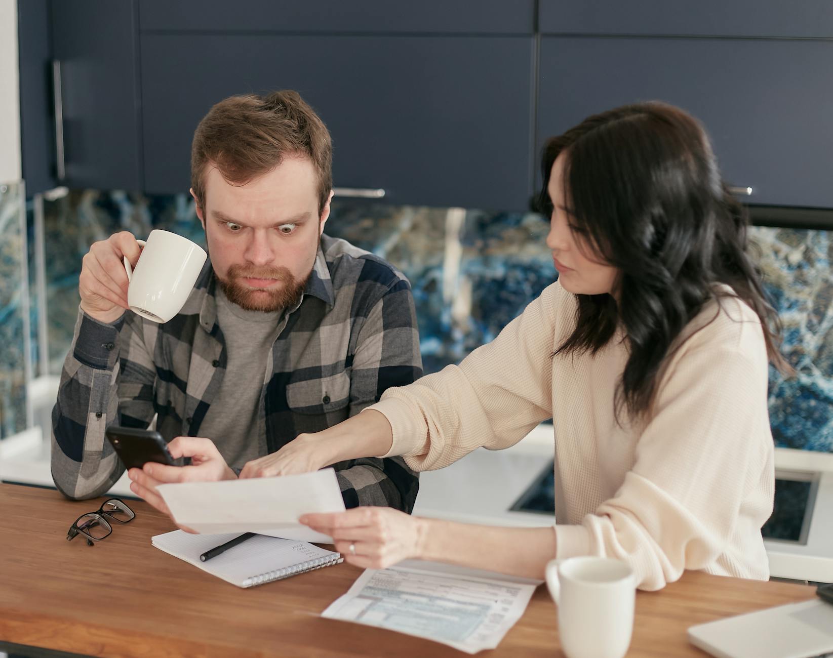 Person reviewing utility bills and apartment running costs