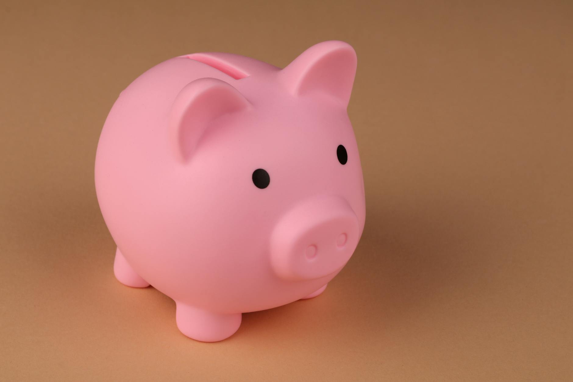 Person tracking savings progress and building long-term money habits