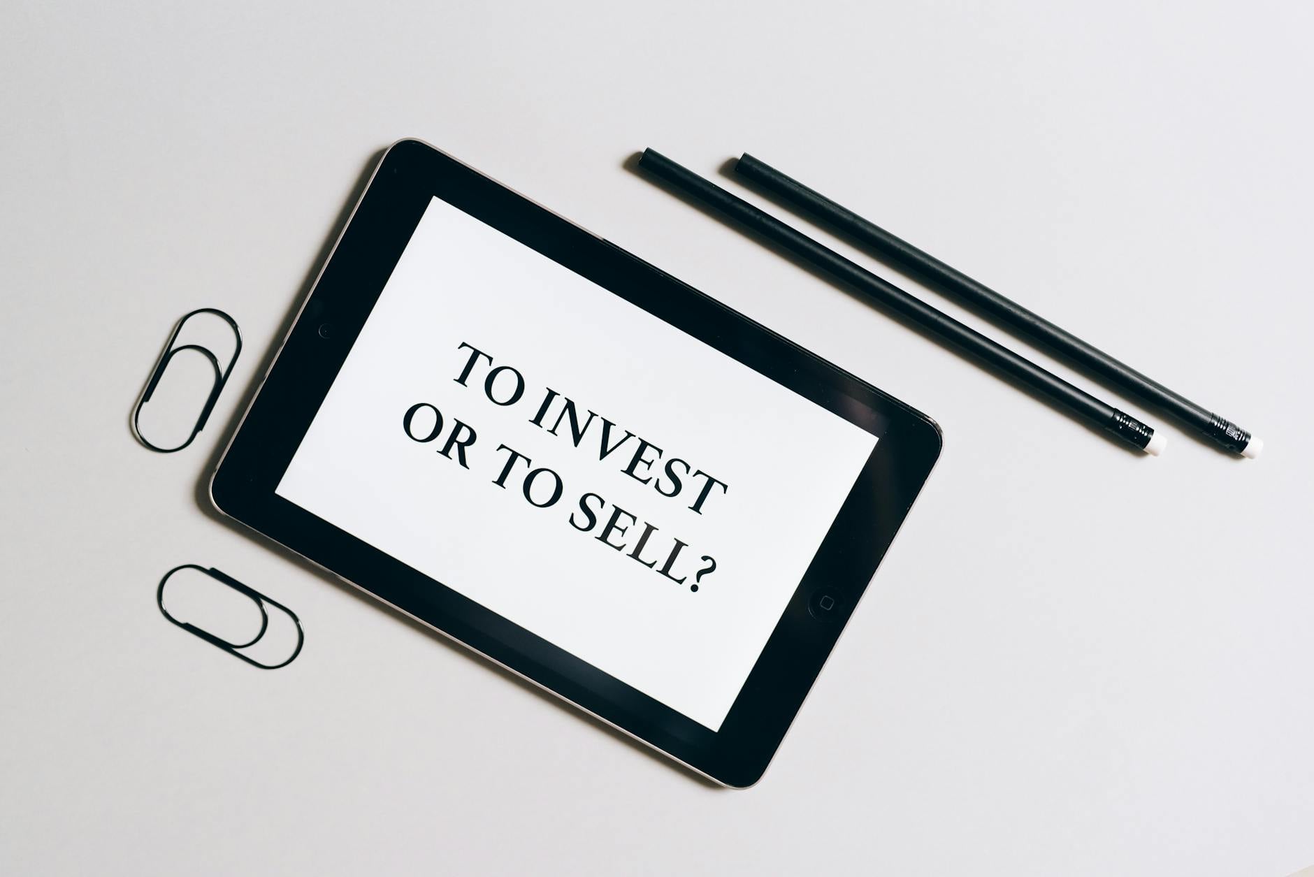 Person at desk reviewing investment options and making a financial decision