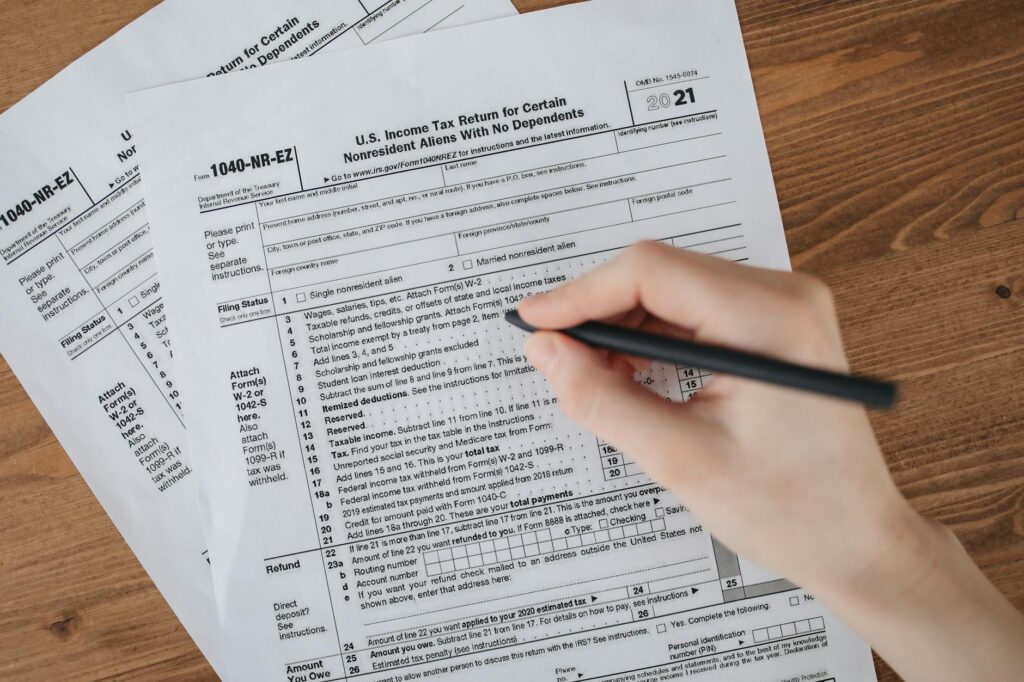 Tax forms and documents spread on a desk