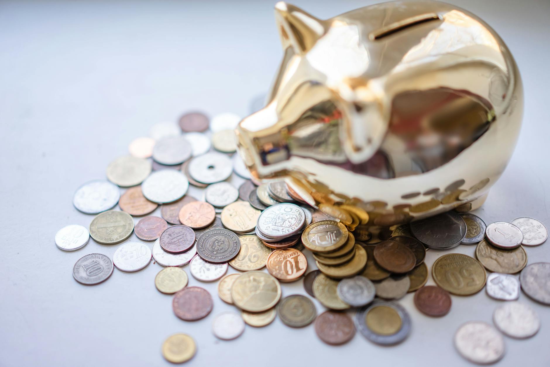 Savings jar with coins representing an emergency fund for unexpected expenses